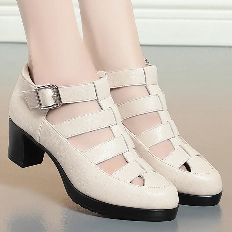 Women's beige closed toe sandals with a chunky heel, woven upper, and ankle strap buckle.