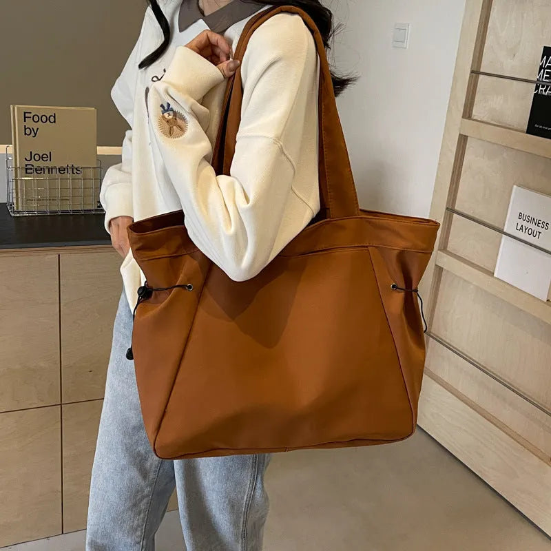 Soft Oxford cloth folding tote bag shown in multiple colours: black, brown, grey, and purple.