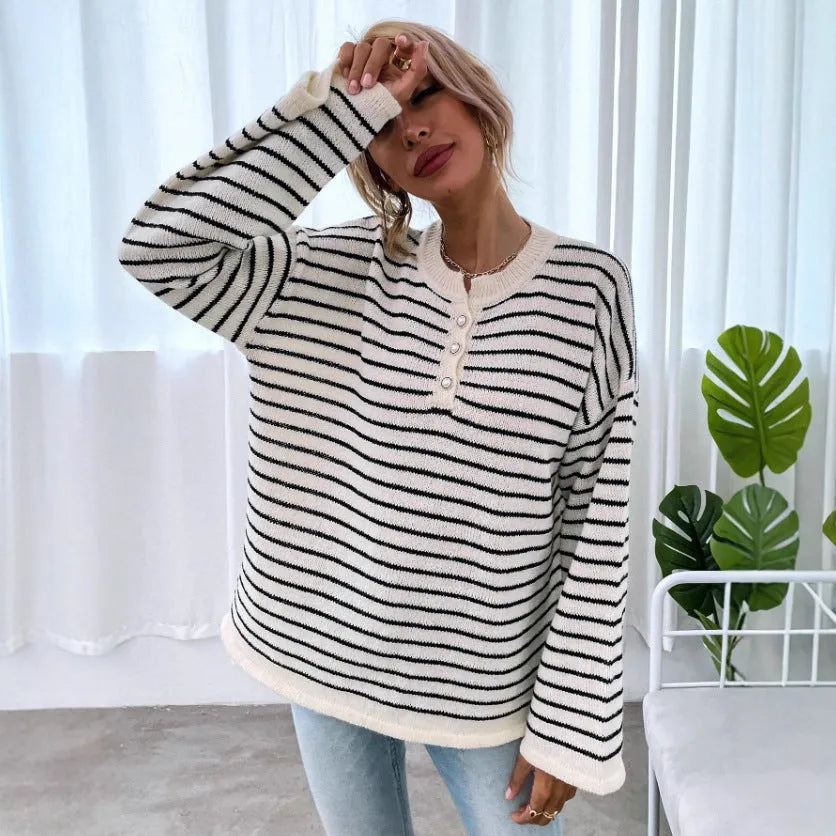 Women's black striped casual top with drop-shoulder sleeves and button details