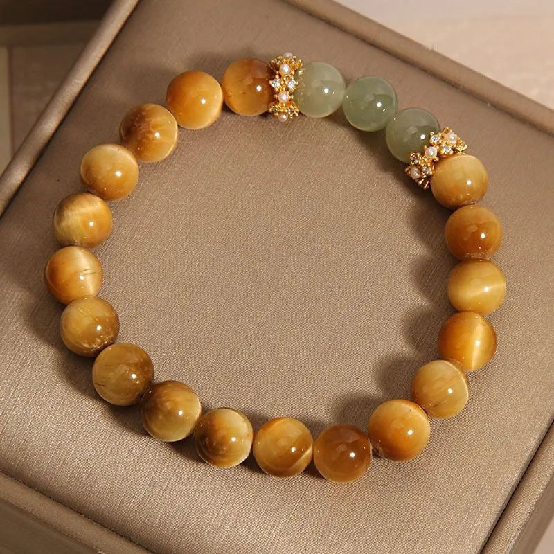 Natural yellow Tiger's Eye Hetian Jade bracelet with symbolic Chinese patterns in U-shaped design