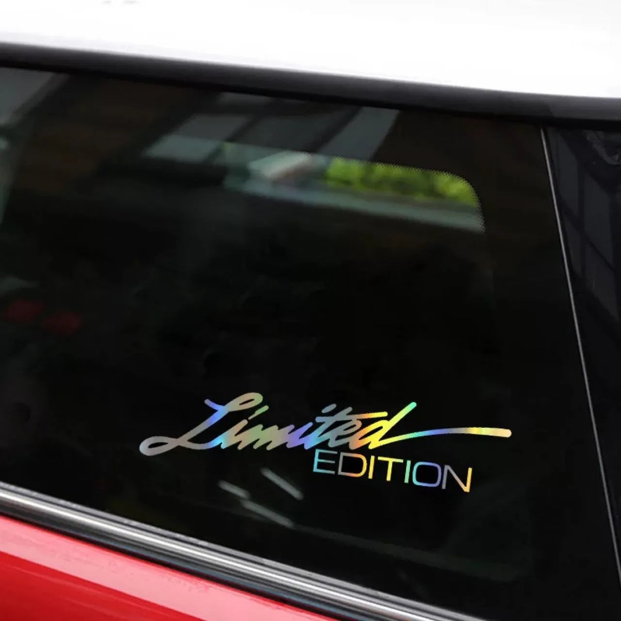 Black laser reflective car sticker with text design on PET material for vehicle personalisation.