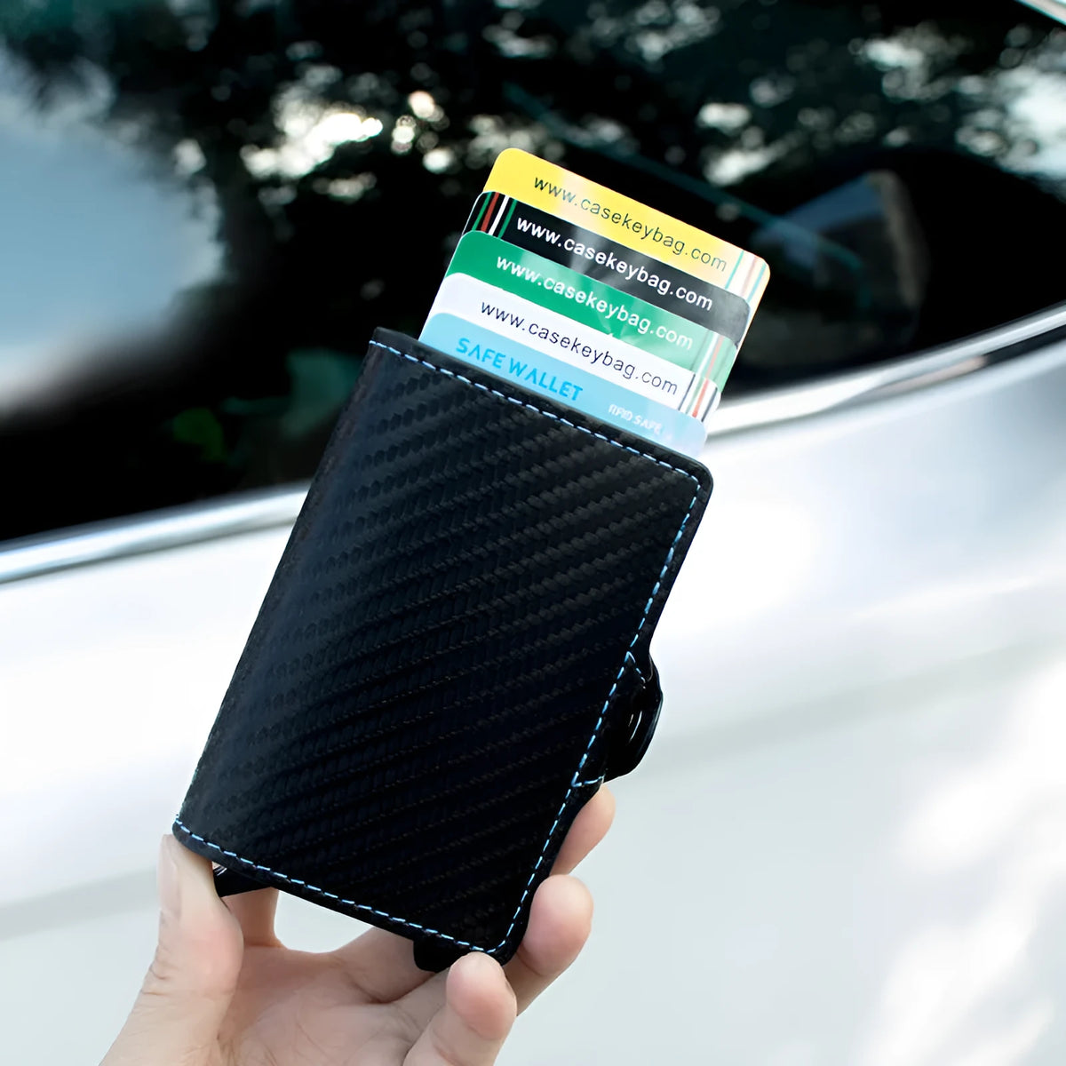 Zipper RFID card holder in carbon fibre with plaid finish, black leather with blue stitching, showing card slots and secret compartment