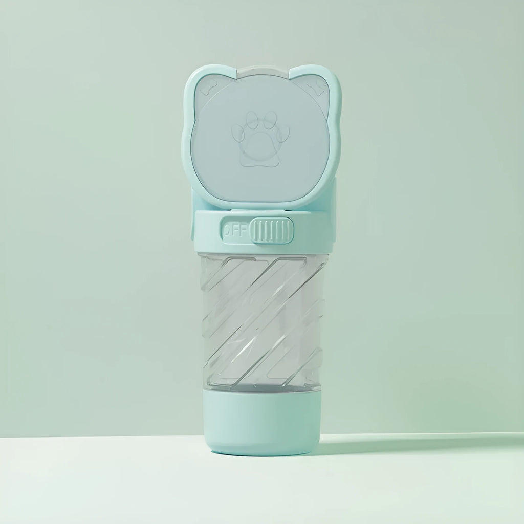 Green 3-in-1 portable pet water bottle with integrated food container and waste bag dispenser on a strap.