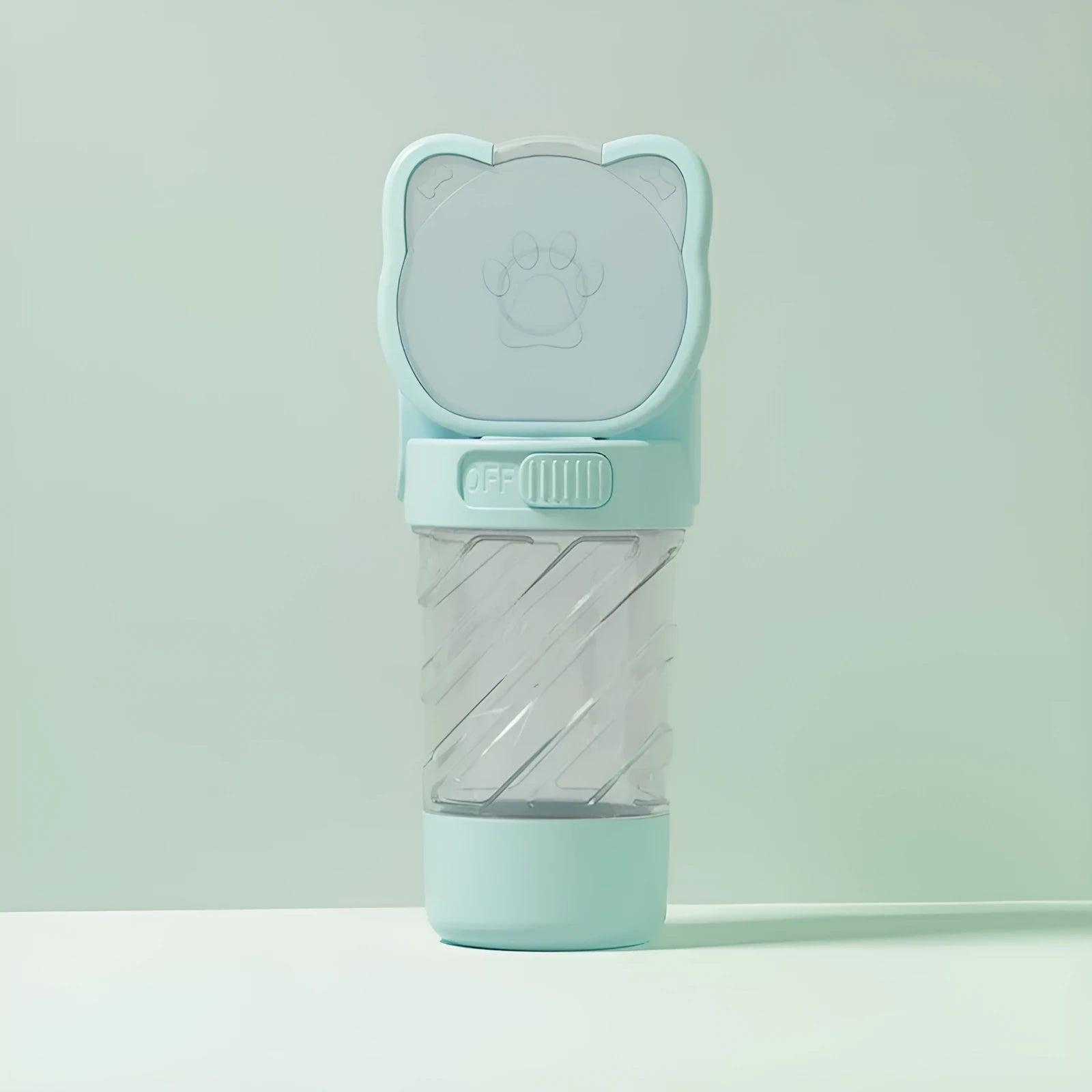 Green 3-in-1 portable pet water bottle with integrated food container and waste bag dispenser on a strap.