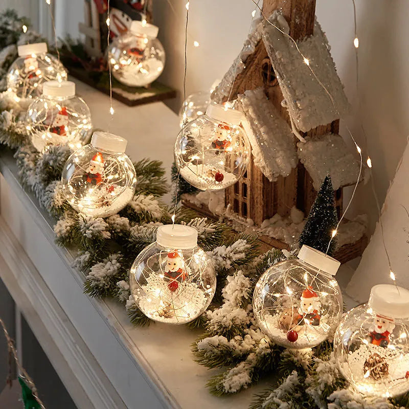 Set of 10 LED Christmas curtain lights with fairy and snowman wishing ball designs on a string.