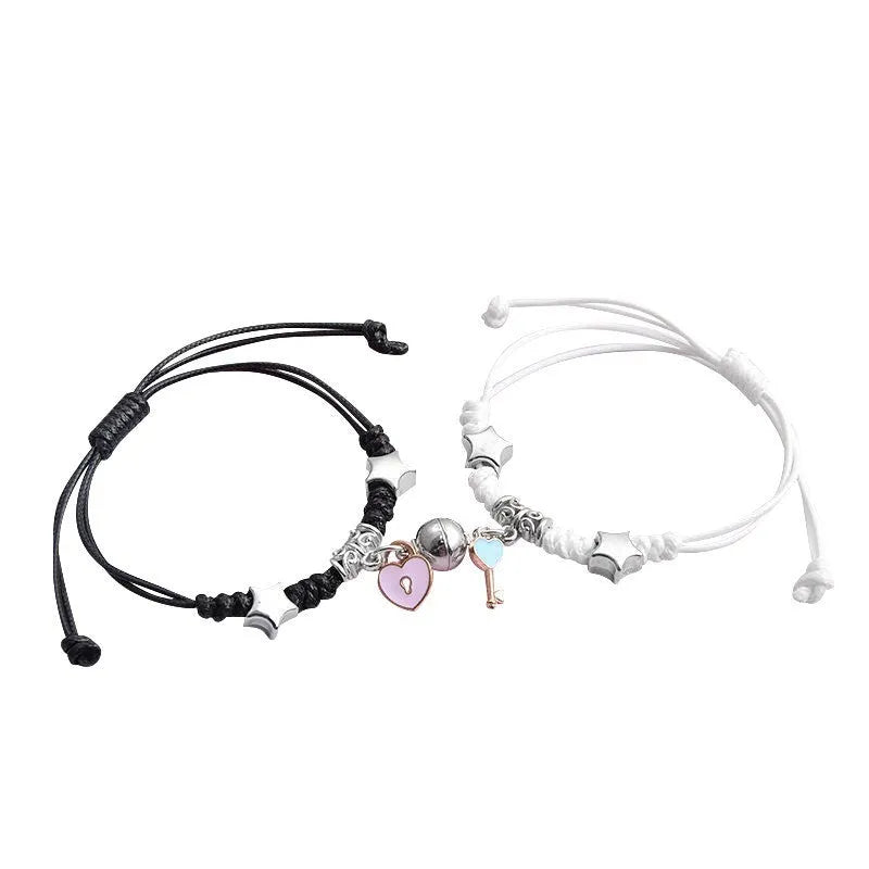 Pair of silver alloy magnet clasp couple bracelets showing example designs like clover, crown, and love symbols.
