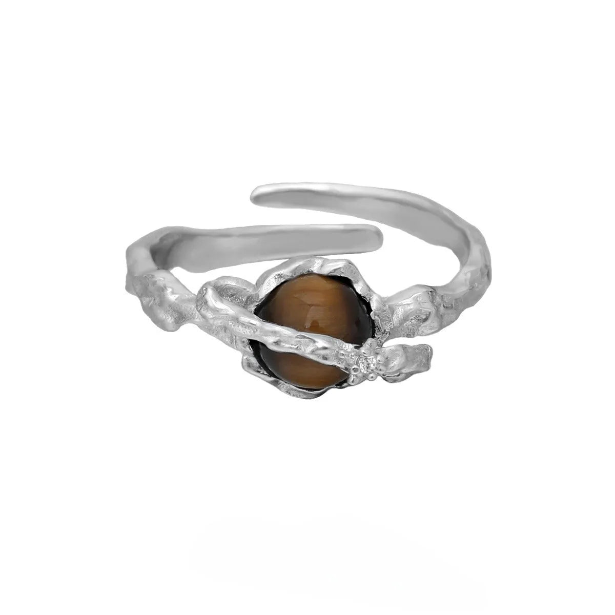 Women's adjustable Saturn design ring in silver with white gold electroplating.