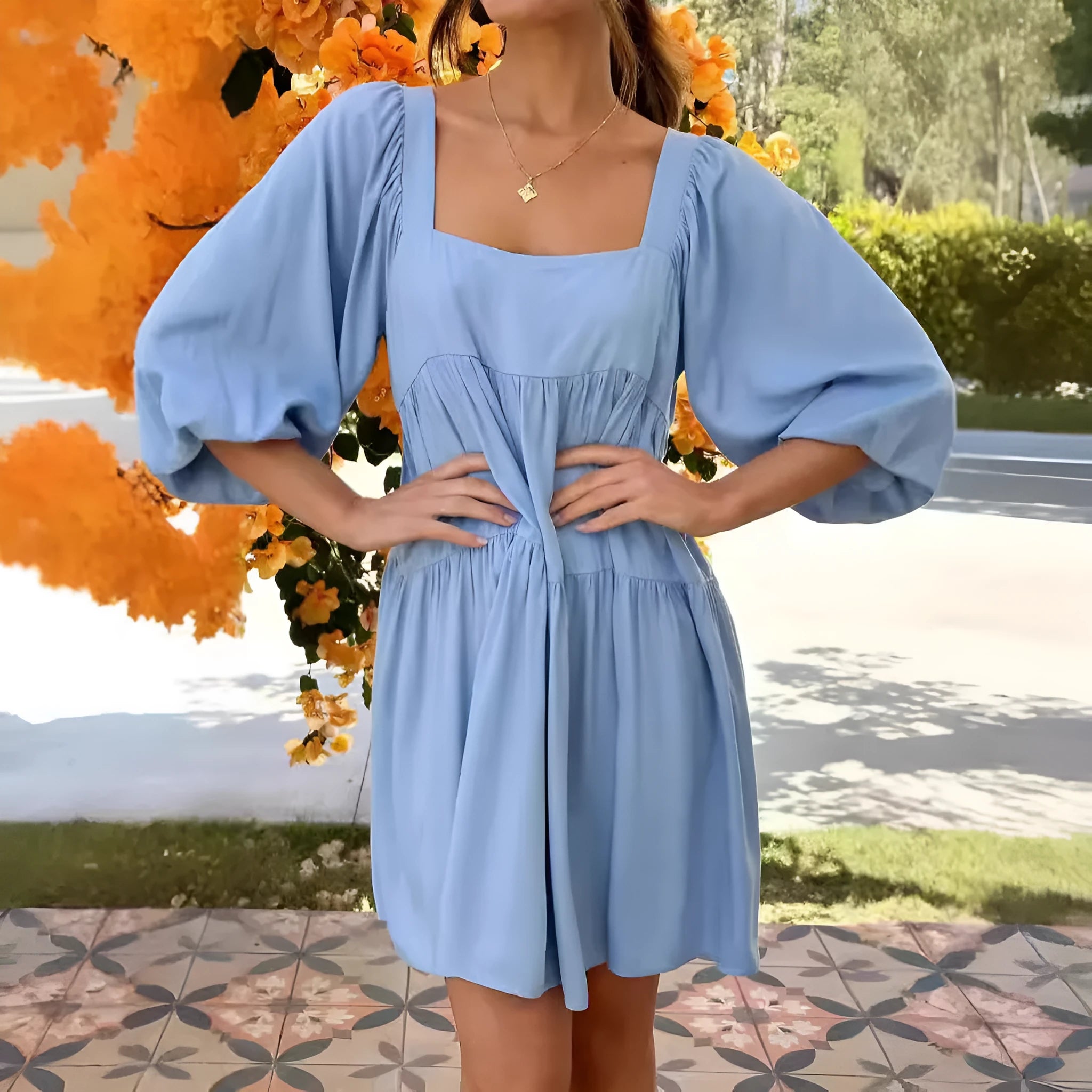 Orange backless children's dress with puff sleeves, a square collar, and a loose A-line skirt.