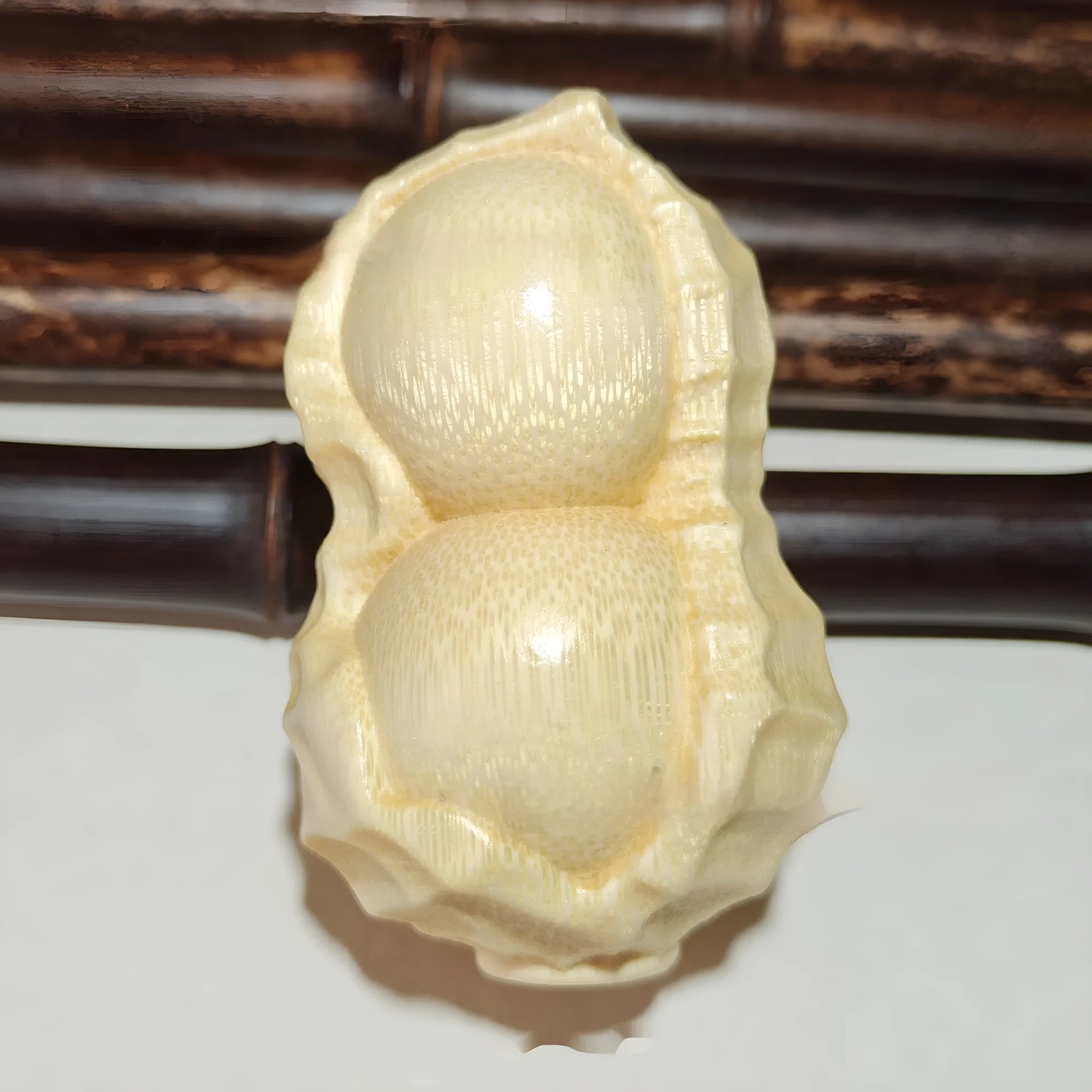 Natural bamboo peanut ornament with modern simplicity design for multiple gifting occasions