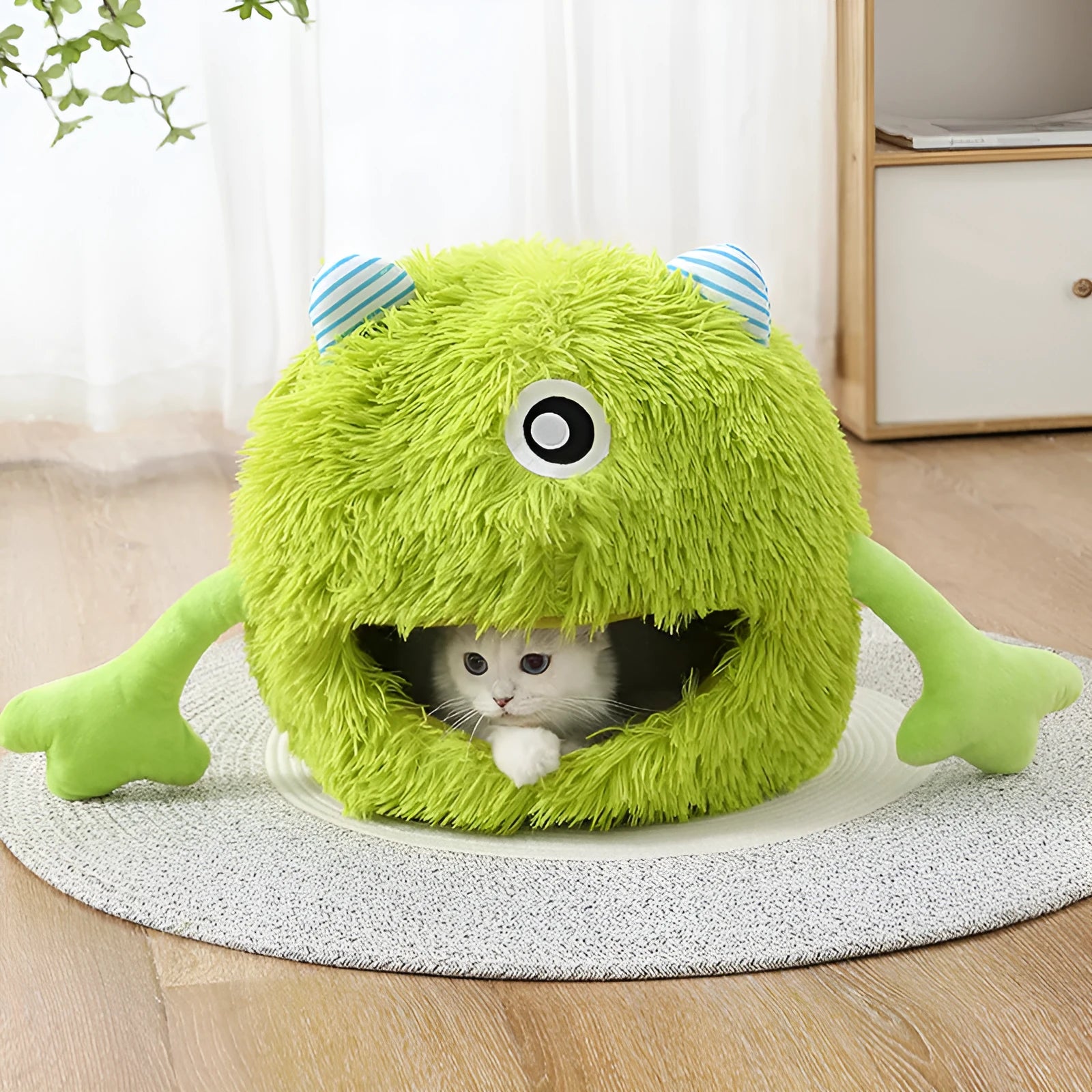 A round, fluffy plush cat bed with a non-slip base, shown in three size options for small, medium, and large pets.