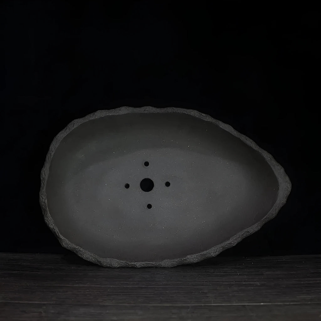 Handmade purple clay flower pot showing colour options and drainage hole styles