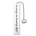 Metal tassel bookmark with stainless steel lettering, shown in one of five colours, next to its gift box.