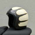Retro style fibreglass half motorcycle helmet shown in a choice of colours like cement grey and matte black.