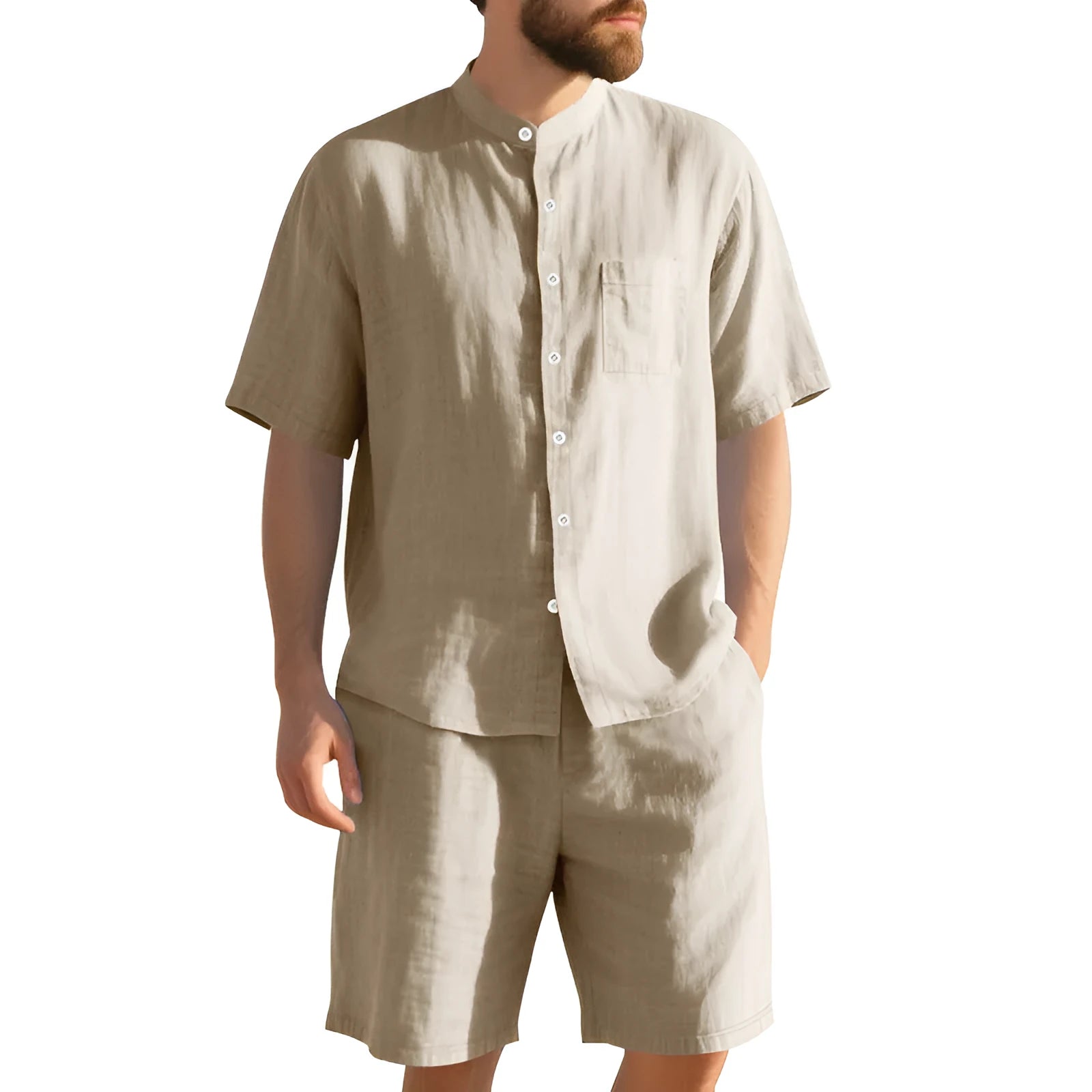 Man wearing a light blue short sleeve linen shirt jacket and matching shorts, a two-piece summer suit.