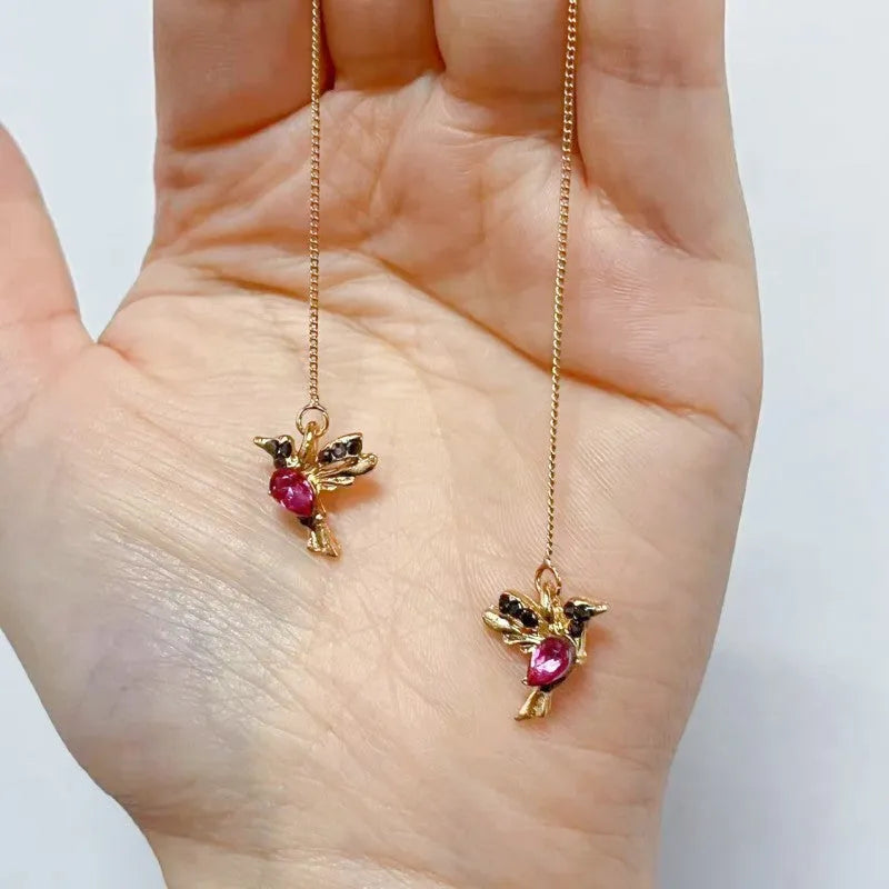 Women's long style bird hanging dangle earrings with mixed zirconium wing details in alloy construction