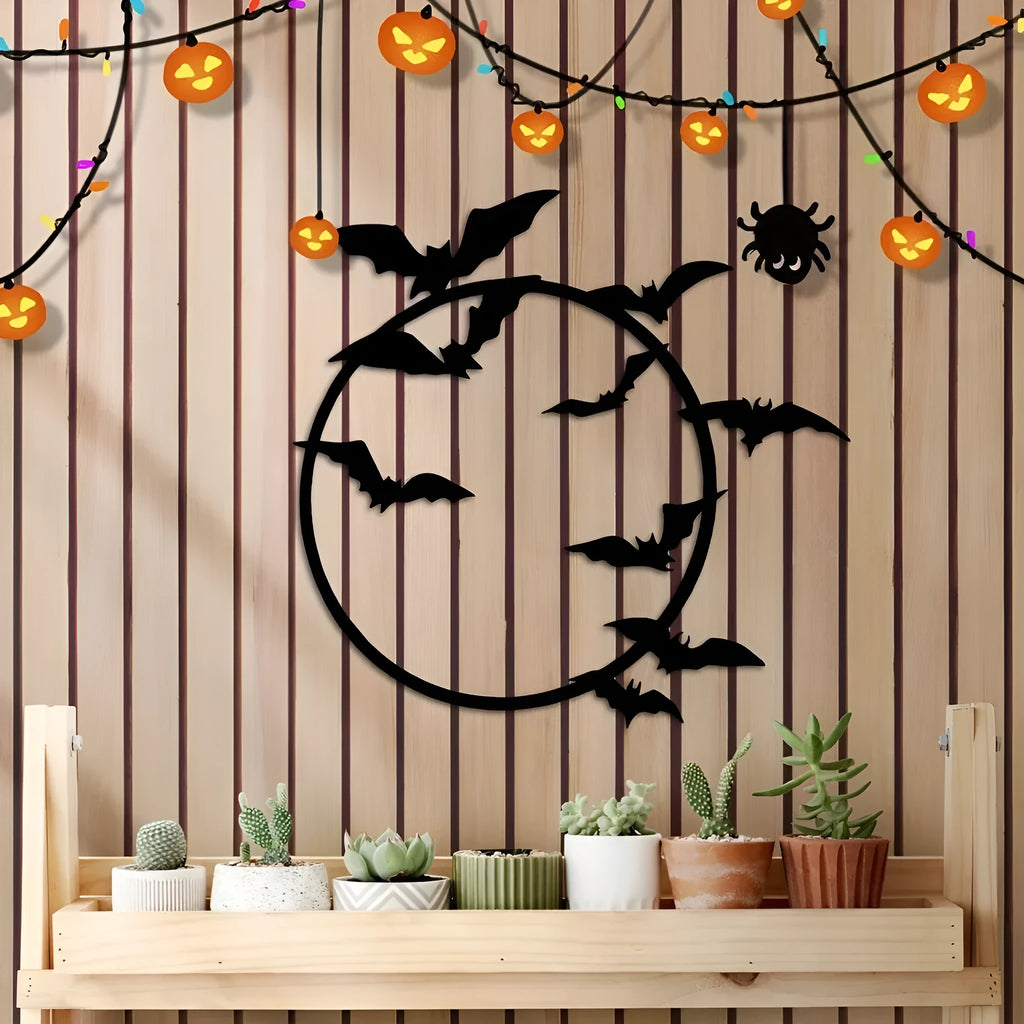 Black iron flying bat metal wall art in geometric style, 14x13.52 inch size on a light wall