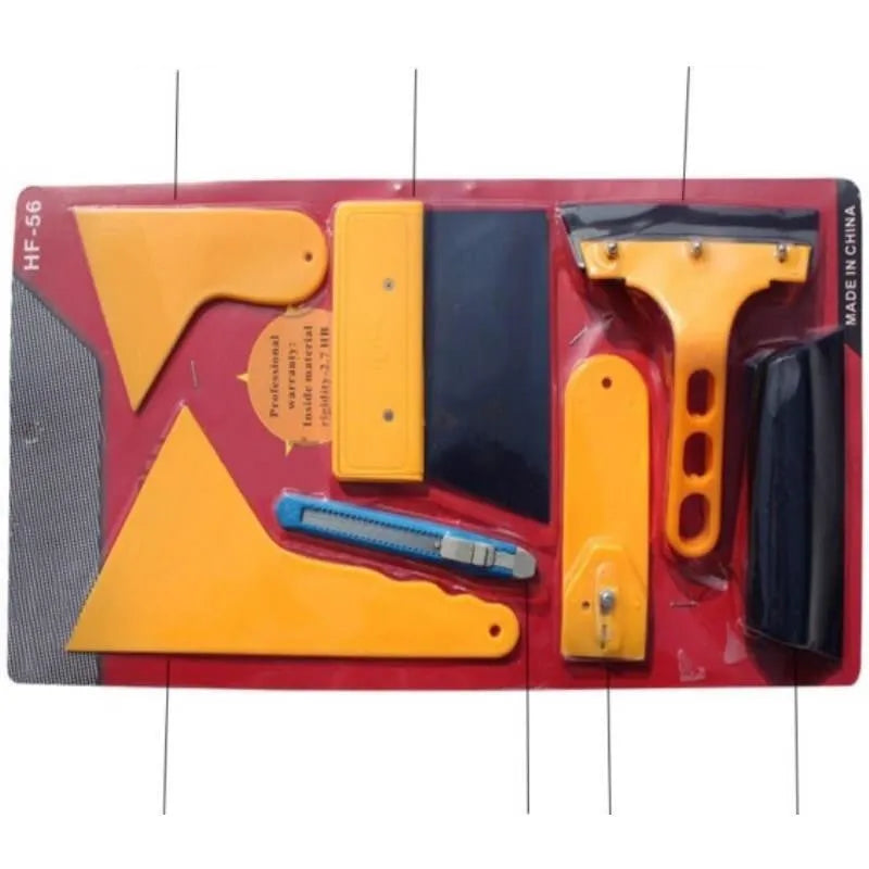Seven-piece automotive and architectural film tool set with scrapers, knives, and a pressing block.