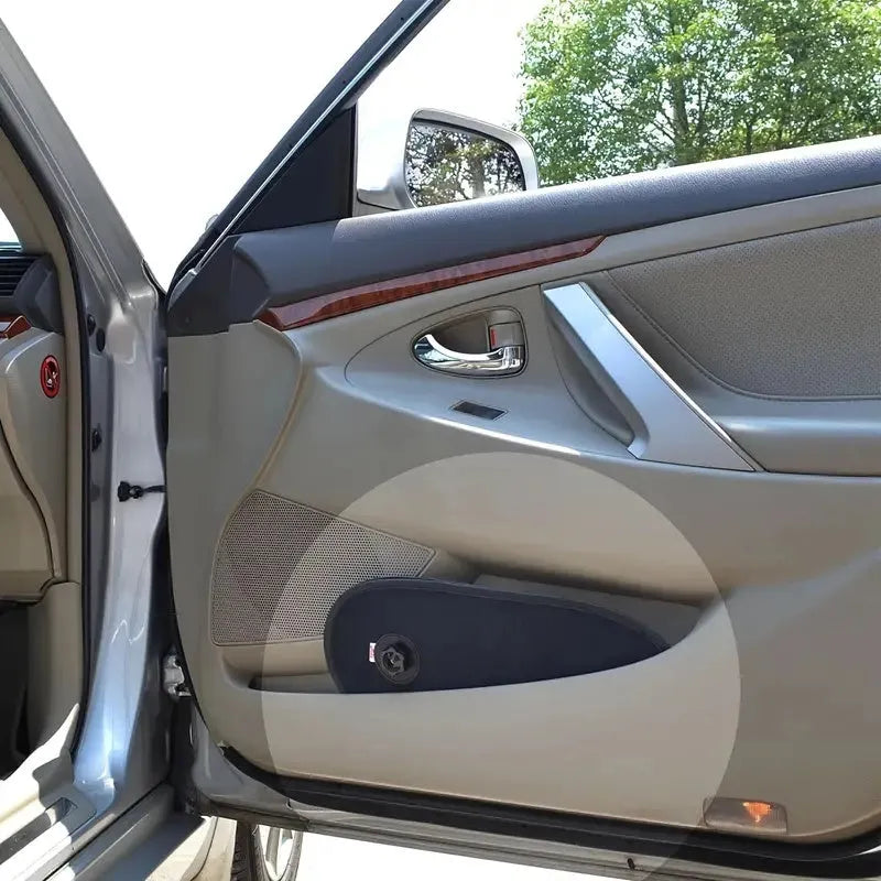 Black breathable car side window shade with suction cups stretched over a car window