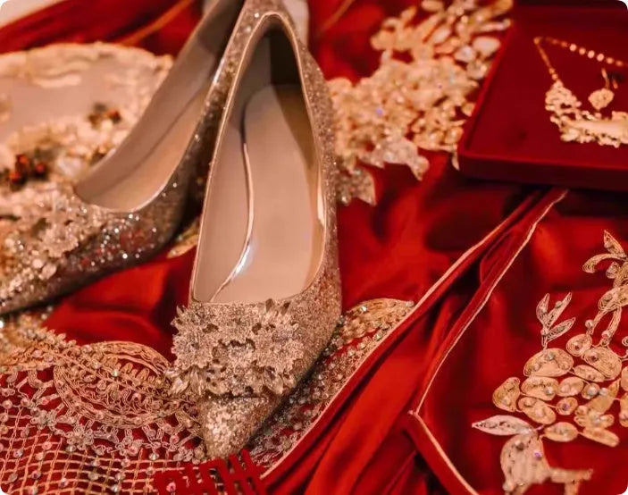 Champagne-coloured women's bridal shoes with rhinestone details, pointed toe, and a fine heel.