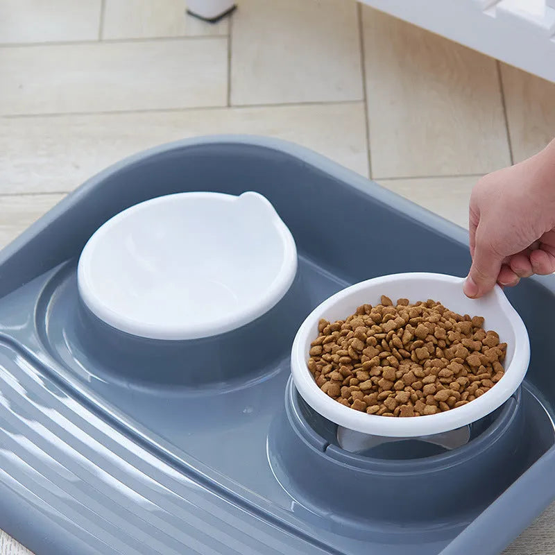 Double plastic pet bowl in grey, blue, green, or pink, measuring 45x35x8cm with anti-skid base.