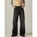 Black loose-fit straight leg denim jeans on a mannequin, showing the zip fly and retro style.