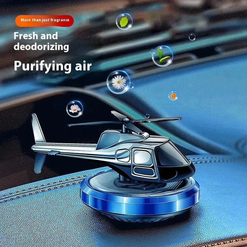Solar-powered metal helicopter car perfume ornament rotating on dashboard