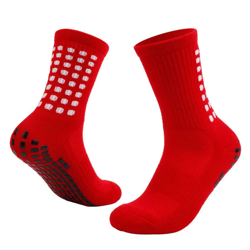 Breathable basketball socks with non-slip rubber stud sole in mid-calf length on court background