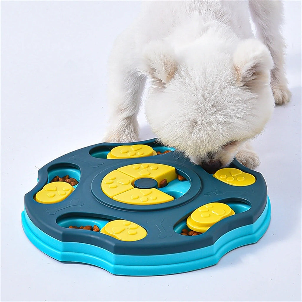 Blue and pink dog puzzle toy feeder bowl for aggressive chewers on a wooden floor.