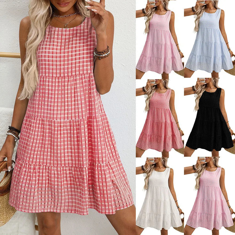 Women's light blue sleeveless plaid dress with high waist and flowing skirt on a model.