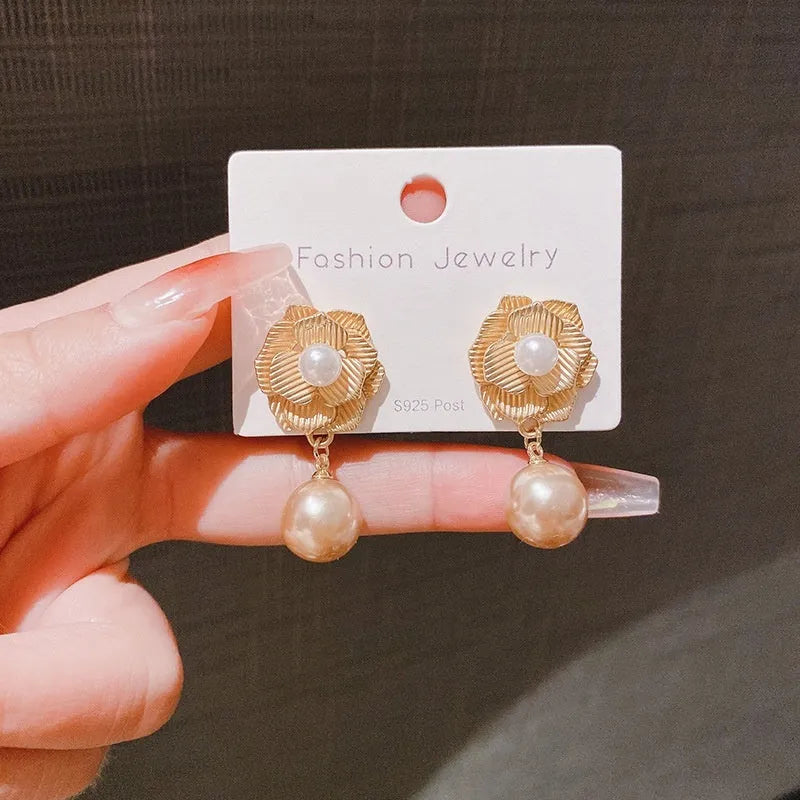 Gold colour stud earrings with rose pearl design, opal stones, and ice flower elements