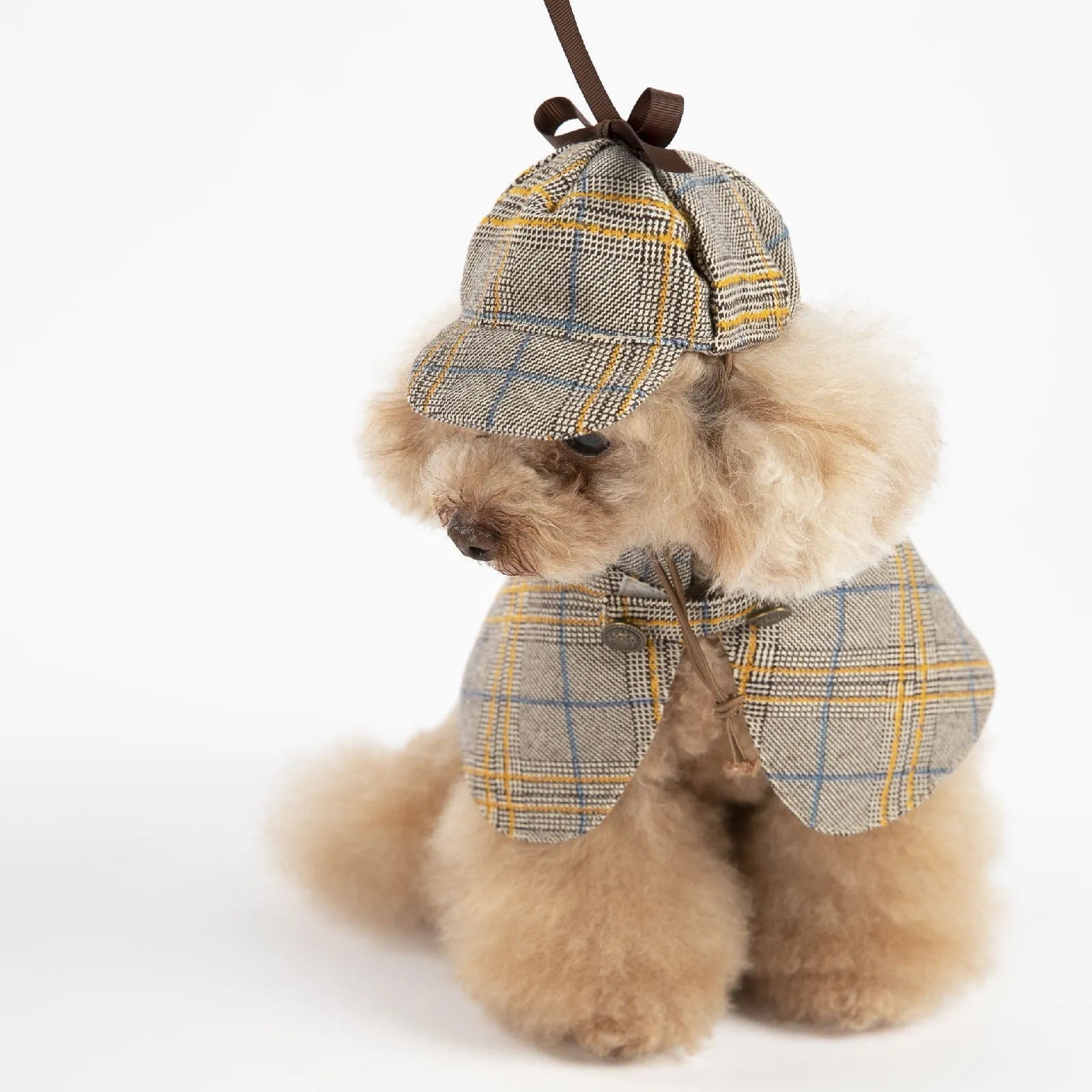 Camel-coloured detective suit style cotton cloak dog coat with an adjustable hat on a pet.