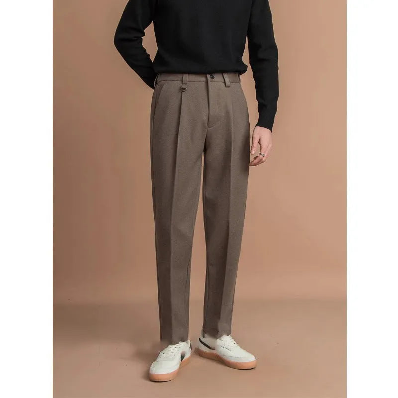 Men's straight-leg suit trousers in a draped fit, shown in a neutral colour.