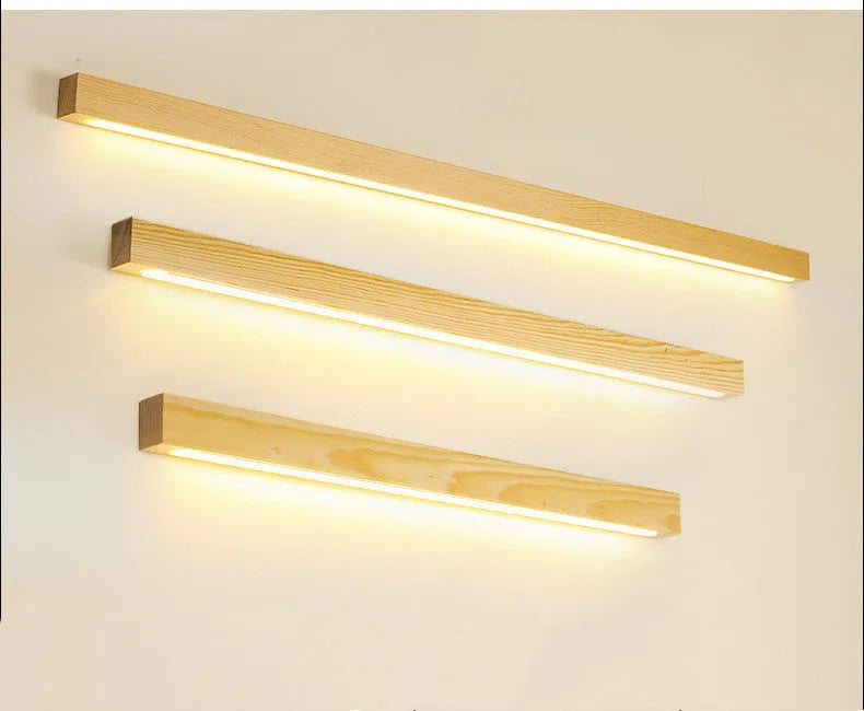 Walnut-coloured long wooden log strip wall lamp with LED lighting in a minimalist design.