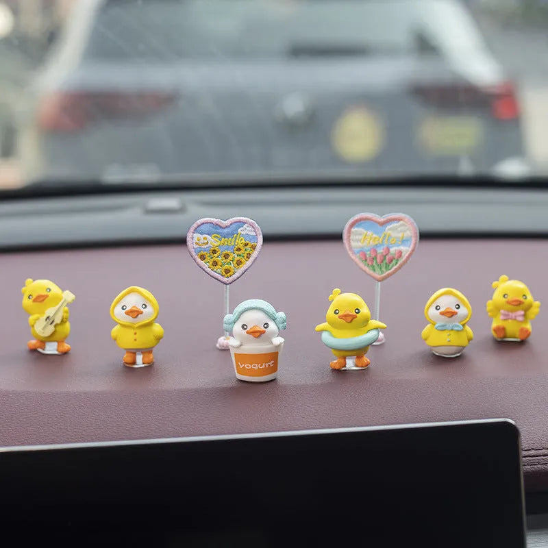 PVC cartoon duckling car decoration set with six yellow ducklings and one sign for dashboard or mirror