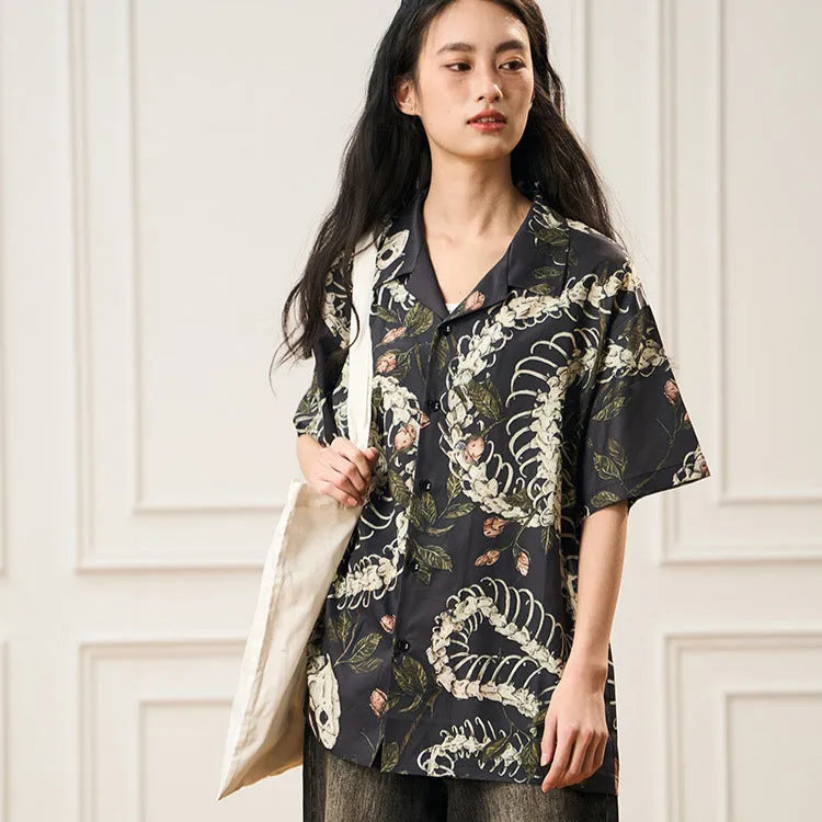 Original snake bone and flower pattern printed on a loose-fit, short sleeve Cuban collar shirt in various colours.