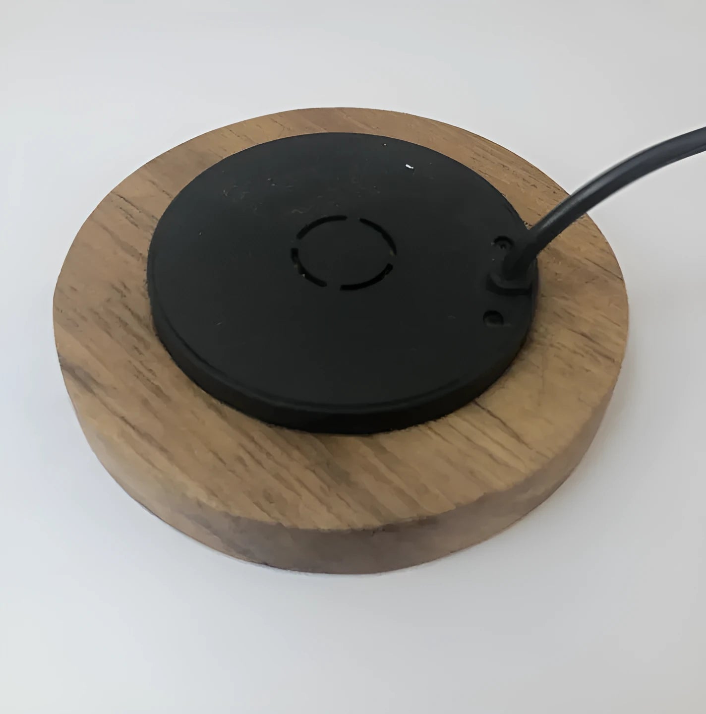 Black 60mm round wireless phone charger for embedded desk and table installation