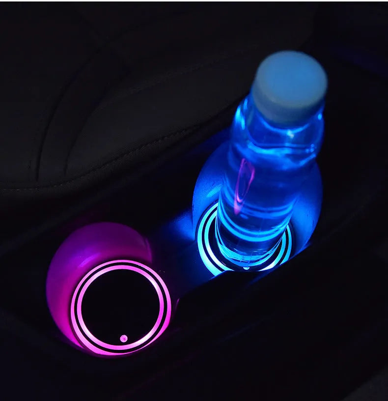 Colourful LED light-up coaster for car cup holder with solar panel and USB port.