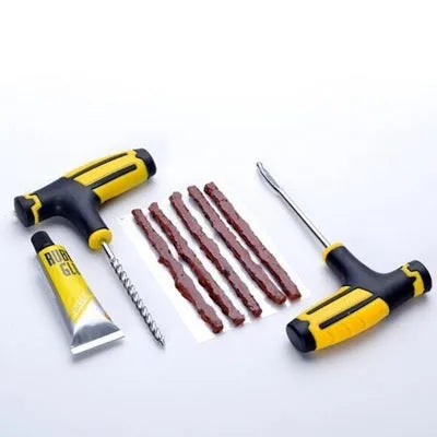 8-piece vacuum tyre repair tool set showing probe, insertion pin, glue and rubber strips in a plastic case.