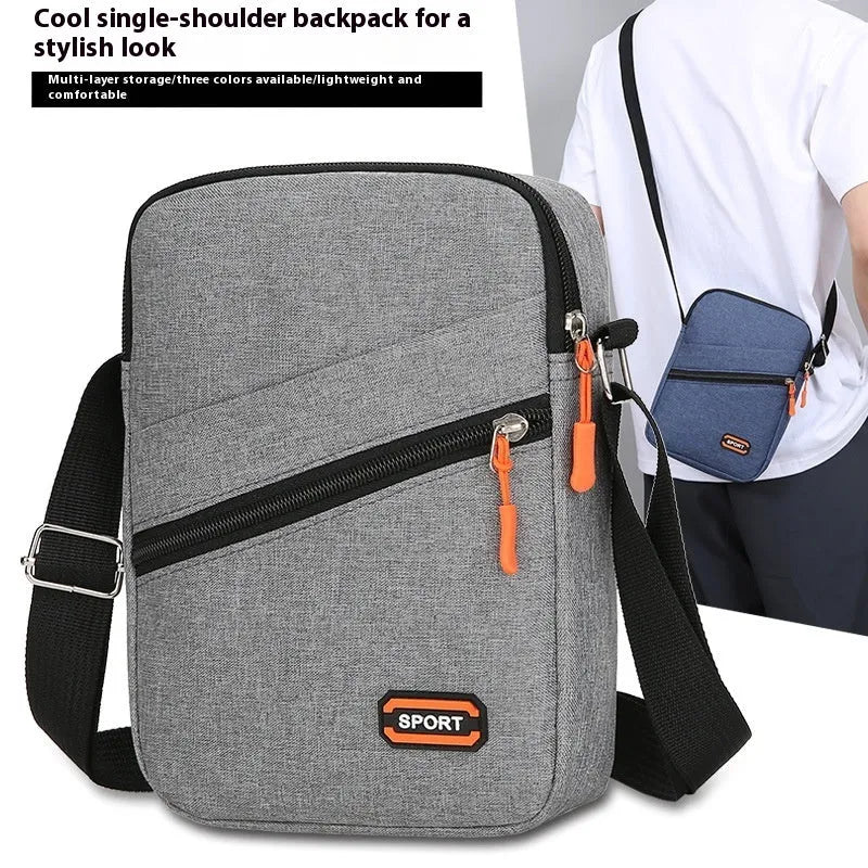 Ultra light Oxford cloth crossbody commuter bag in black, navy blue, or silver grey.
