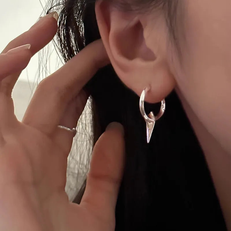 Women's platinum-coloured geometric star ear clips with a white gold plated finish.