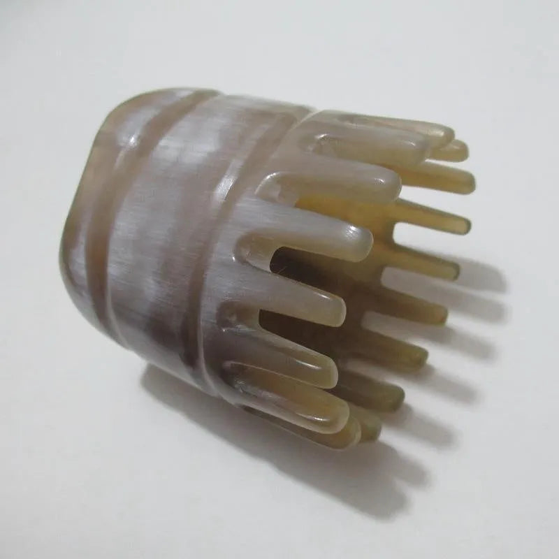 White buffalo horn female head meridian massage comb with pointed tips and wide teeth sections
