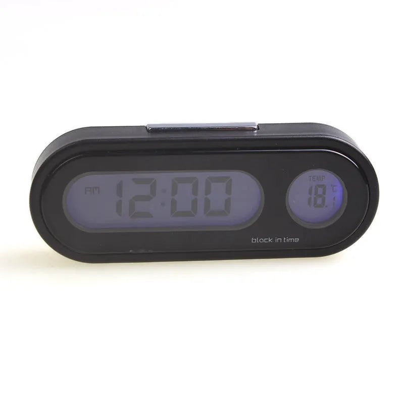 Black car dashboard clock thermometer with digital LED display showing time and temperature