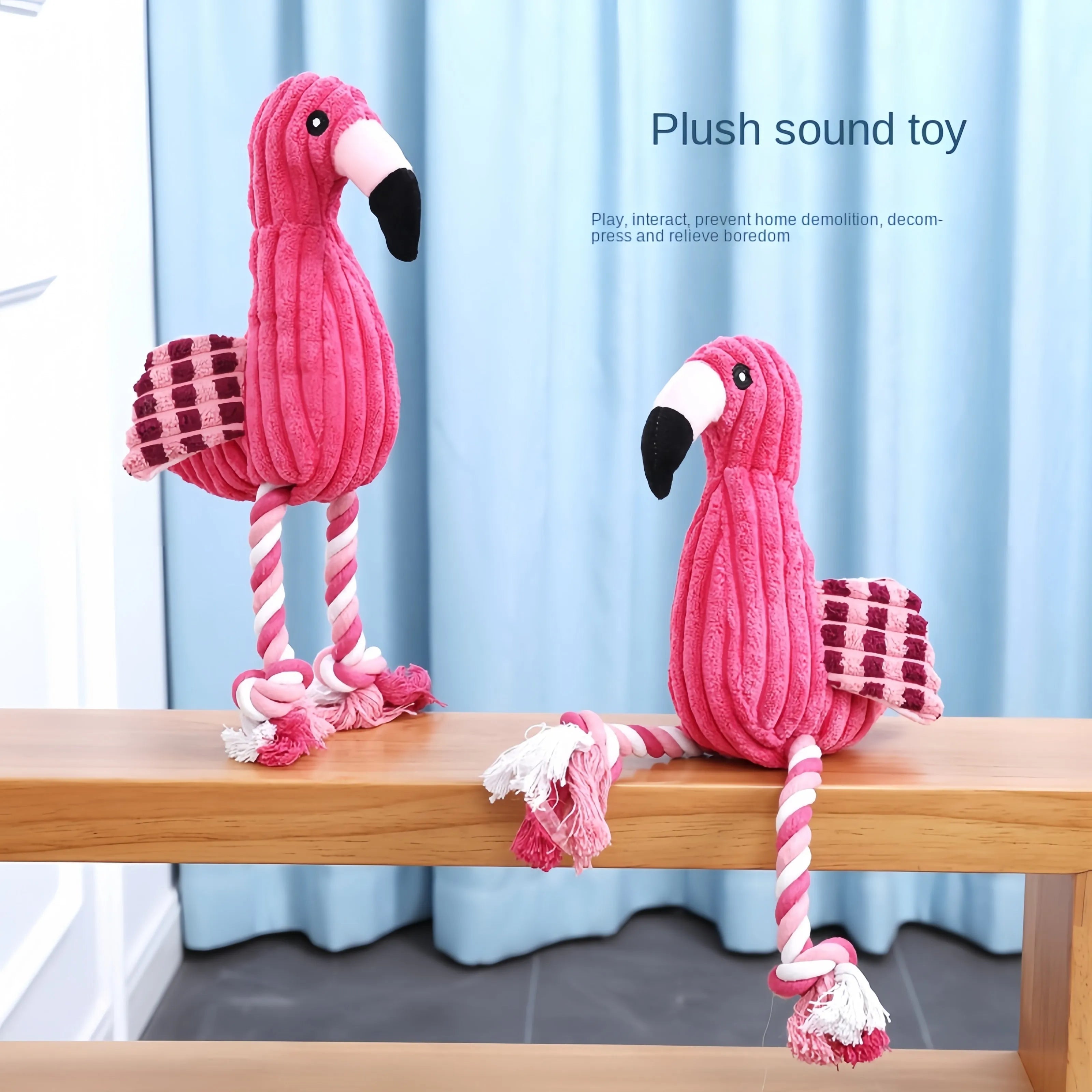 Pink corduroy animal-shaped plush dog toy with squeaker on a neutral background.