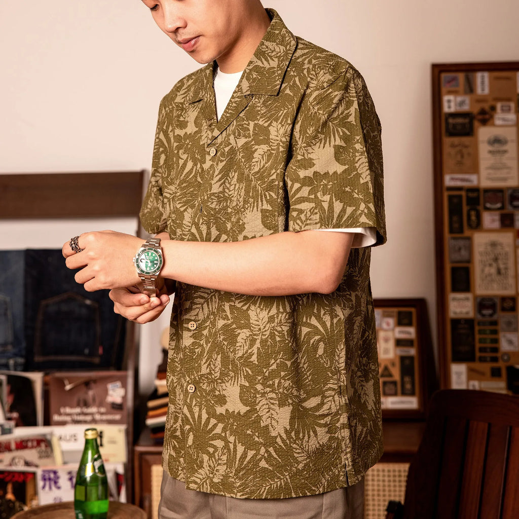 Vintage floral print seersucker shirt with a Cuban collar on a mannequin, showing loose cardigan fit.
