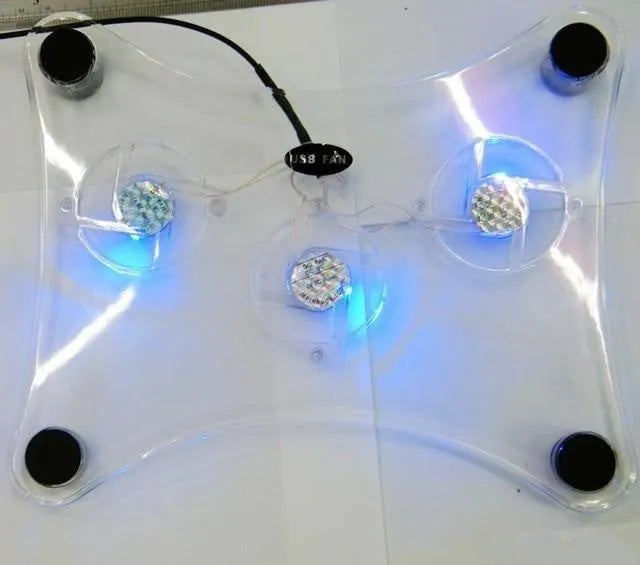 Transparent laptop cooling pad with three fans, 290mm x 160mm x 40mm inclined body and four rubber pads