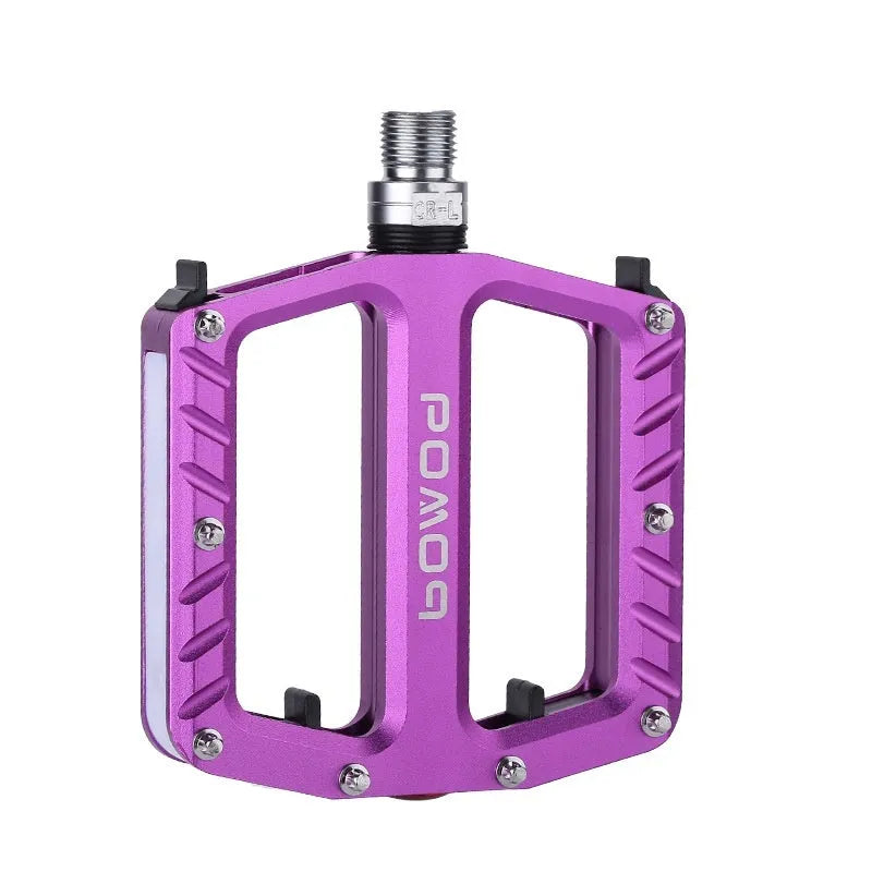Pair of aluminium alloy bicycle pedals with integrated LED lights in multiple colour options.