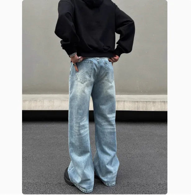 Men's blue straight jeans with whisker wash details and flared leg style