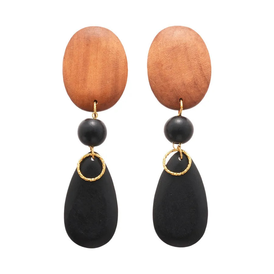 Wooden retro earrings with silver brown black colour scheme and elliptical design elements