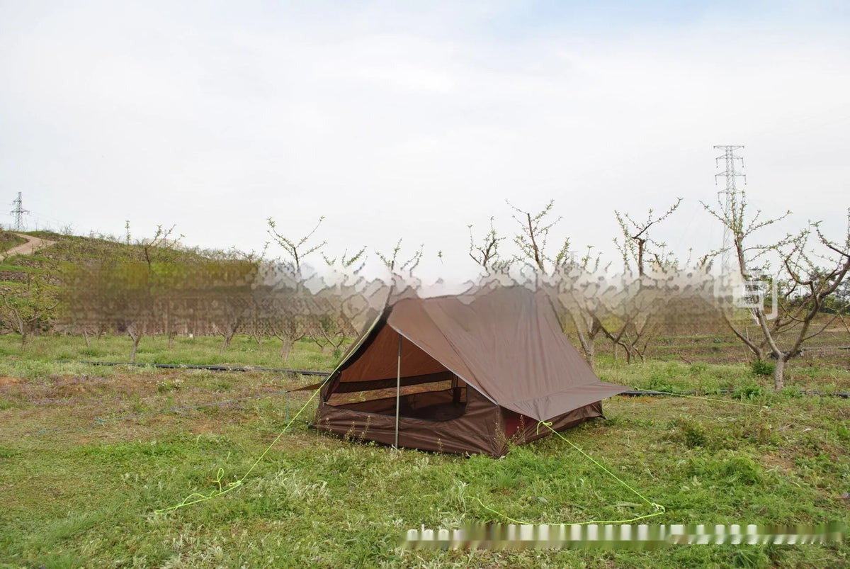 Brown A-line pole-free cabin tent set up with hiking poles showing spacious interior for 2-3 campers