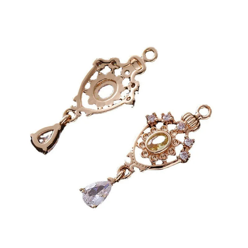 Copper water drop pendant with micro inlaid zircon crown design in gold, rose gold, or silver electroplate.